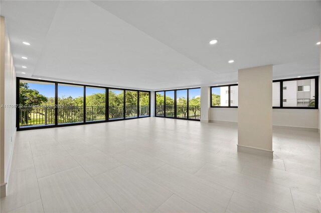 700 Coral Way Unit 2, Coral Gables, FL 33134 - empty room with a wall of windows and recessed lighting