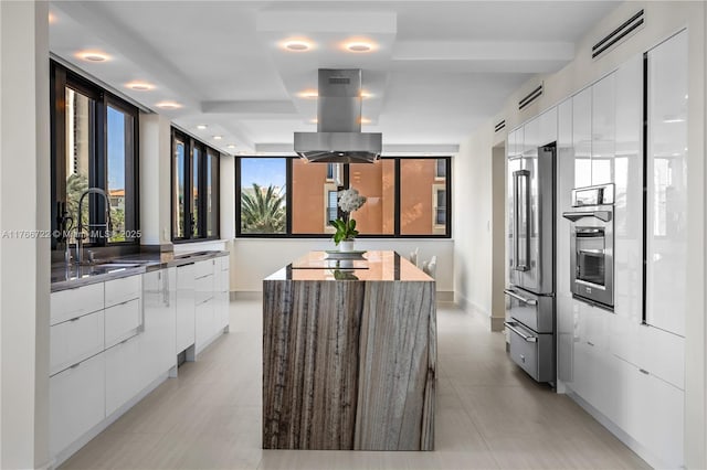 700 Coral Way Unit 2, Coral Gables, FL 33134 - kitchen with modern cabinets, appliances with stainless steel finishes, a sink, and white cabinetry