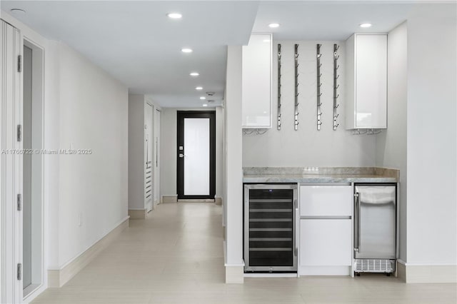 700 Coral Way Unit 2, Coral Gables, FL 33134 - bar with beverage cooler, recessed lighting, baseboards, and stainless steel built in fridge