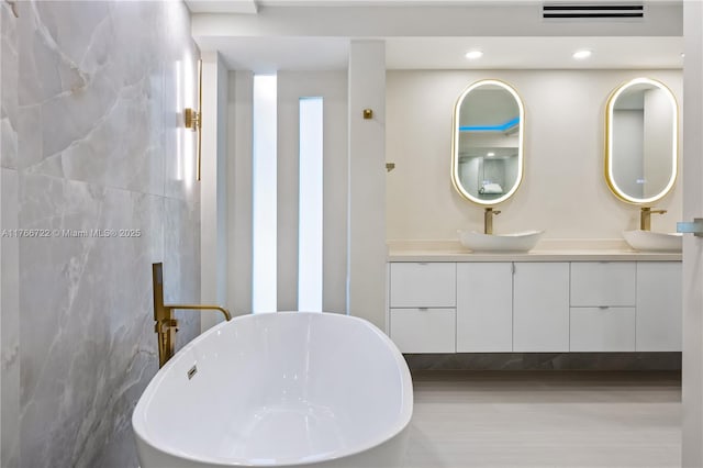 700 Coral Way Unit 2, Coral Gables, FL 33134 - full bath featuring a soaking tub, vanity, and recessed lighting
