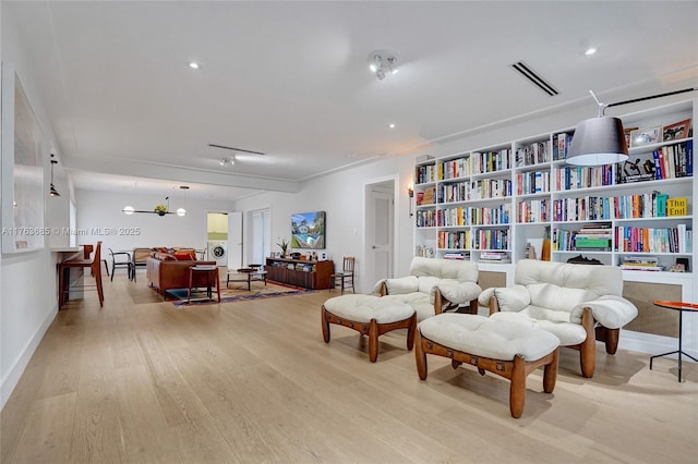 sitting room with light wood-type flooring, recessed lighting, and visible vents