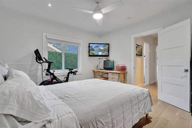 bedroom with light wood finished floors and ceiling fan