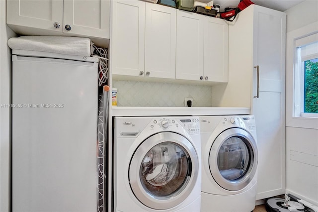 laundry area with cabinet space and washer and dryer