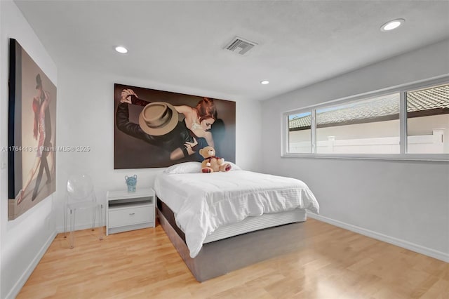 bedroom featuring visible vents, recessed lighting, light wood finished floors, and baseboards