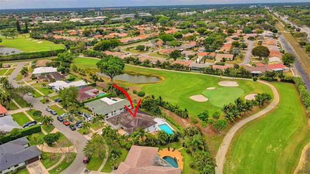 birds eye view of property with a water view and a residential view