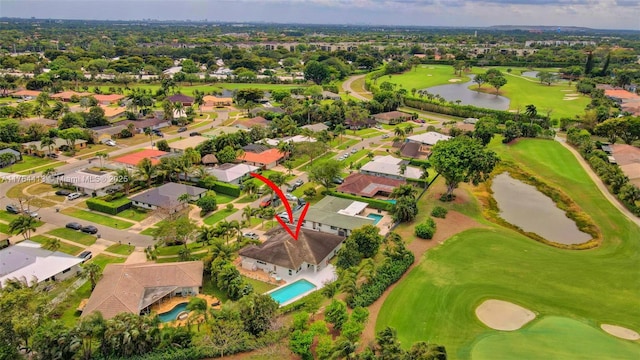bird's eye view with a residential view, view of golf course, and a water view