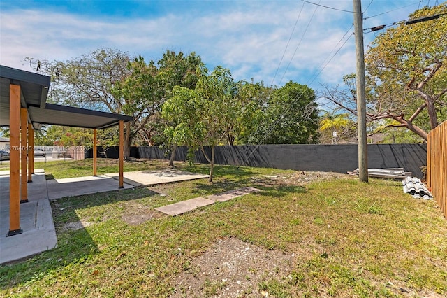 view of yard with a fenced backyard and a patio area