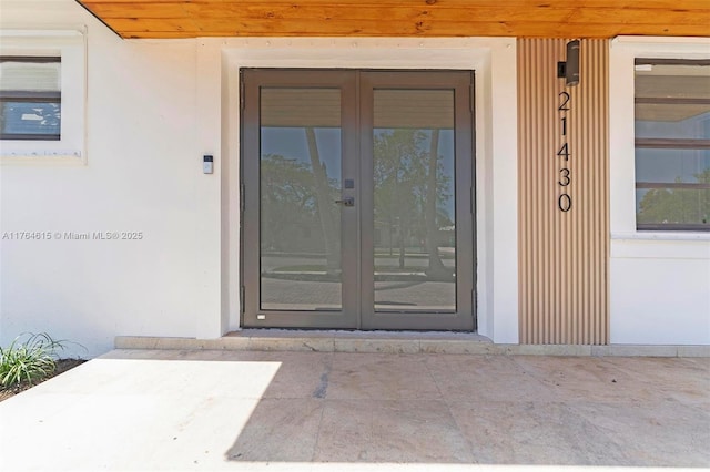 entrance to property featuring french doors