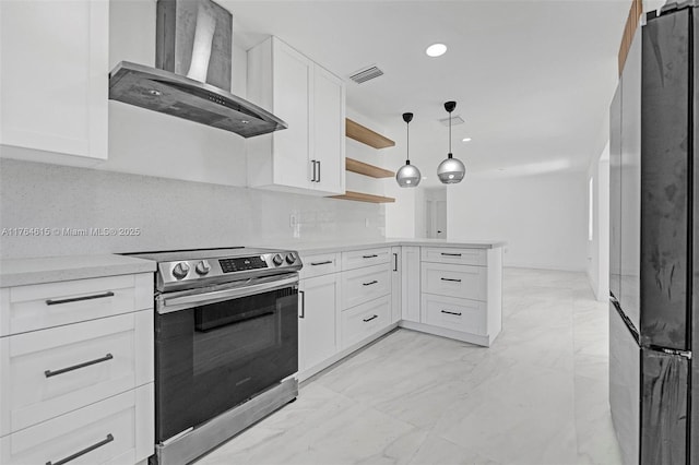 kitchen with stainless steel electric range oven, freestanding refrigerator, light countertops, wall chimney exhaust hood, and marble finish floor