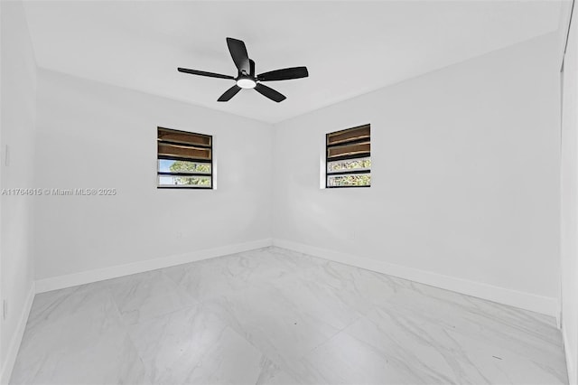 unfurnished room featuring baseboards and ceiling fan