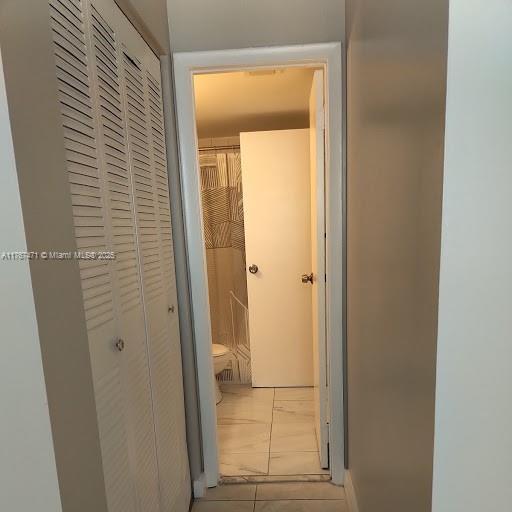16465 NE 22nd Ave Unit 114, North Miami Beach, FL 33160 - corridor with tile patterned floors
