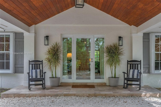 property entrance with stucco siding
