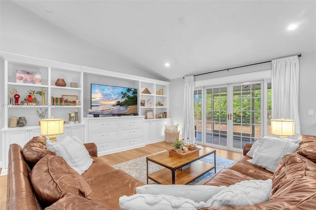 living area featuring vaulted ceiling, recessed lighting, and light wood finished floors