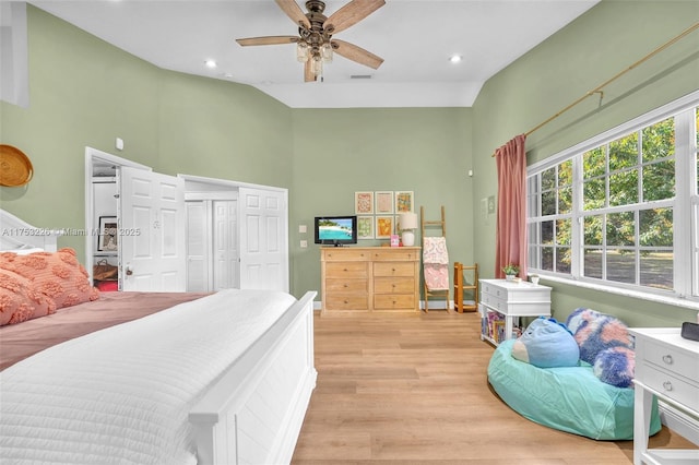 bedroom featuring multiple windows, light wood-style flooring, and recessed lighting