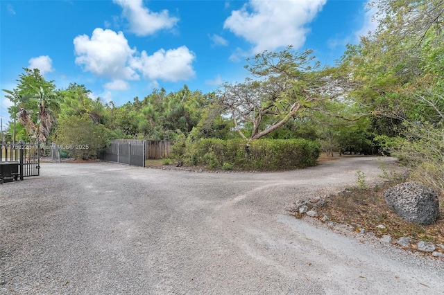 view of road featuring a gate