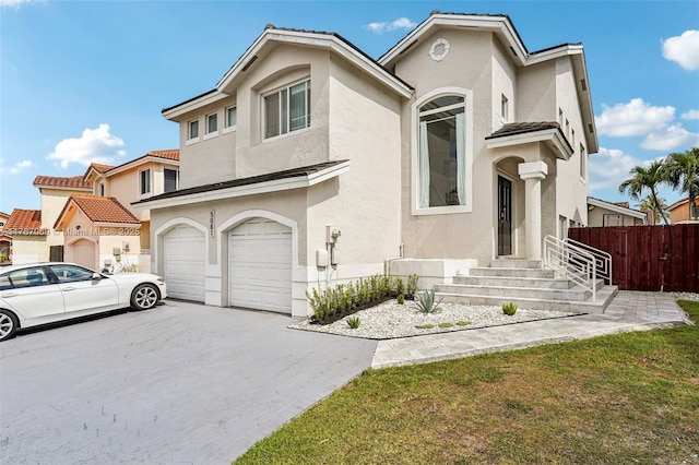 5081 SW 154th Pl, Miami, FL 33185 - view of front of home featuring stucco siding, a garage, and driveway