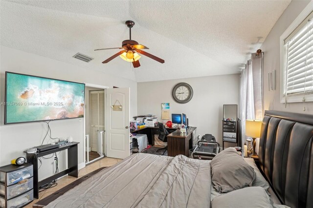 5081 SW 154th Pl, Miami, FL 33185 - bedroom featuring a textured ceiling, light tile patterned floors, and a ceiling fan