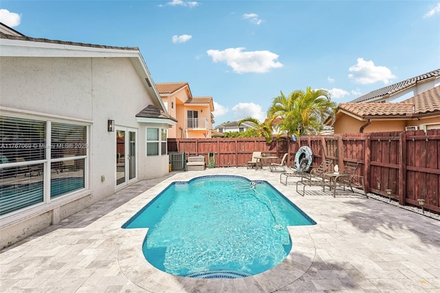 5081 SW 154th Pl, Miami, FL 33185 - view of pool featuring french doors, a patio area, and a fenced backyard