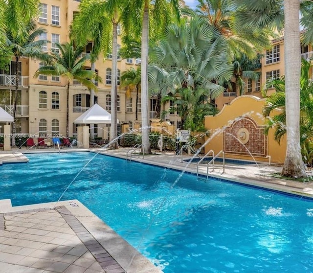 pool featuring a patio area