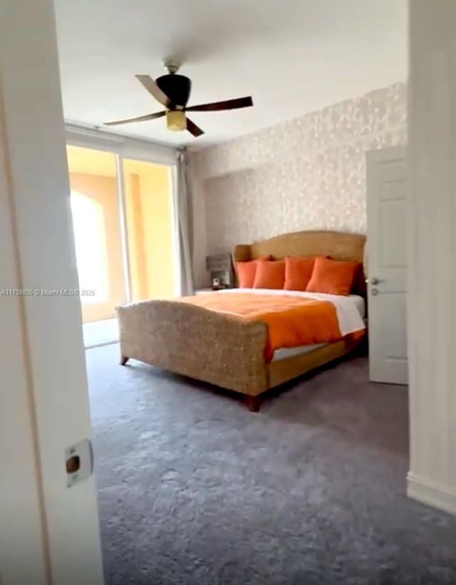 carpeted bedroom with baseboards and a ceiling fan