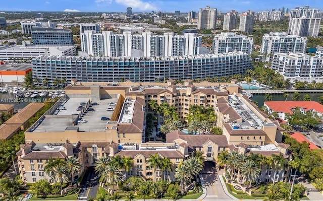 aerial view with a city view and a water view