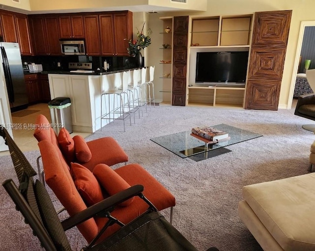 living room featuring visible vents and light colored carpet