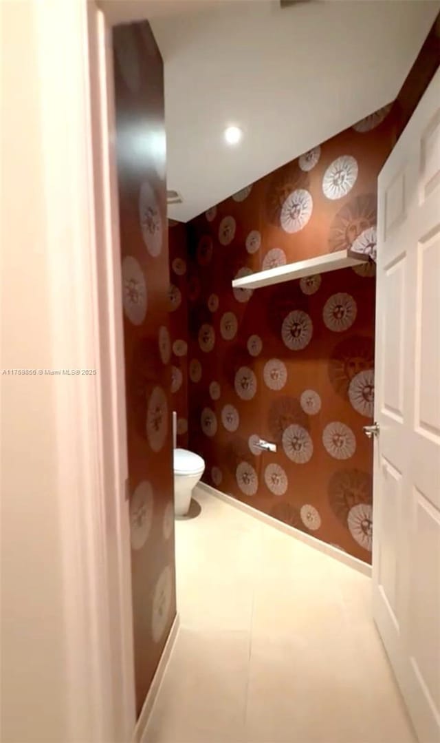 bathroom featuring recessed lighting, toilet, wallpapered walls, and baseboards
