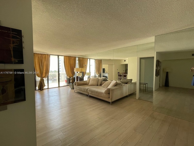 20281 E Country Club Dr Unit 810, Aventura, FL 33180 - living area with floor to ceiling windows, a textured ceiling, and wood finished floors