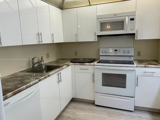 20281 E Country Club Dr Unit 810, Aventura, FL 33180 - kitchen with white cabinetry, a sink, and white appliances