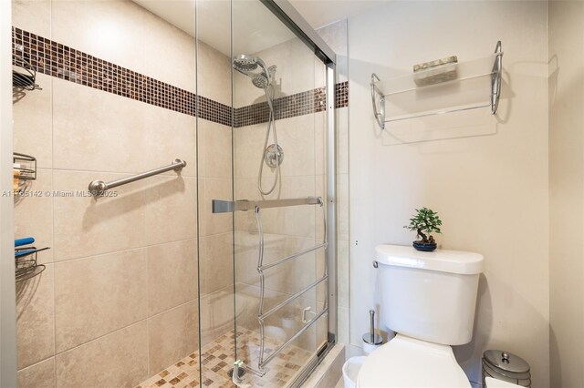 12900 SW 13th St Unit 211E, Pembroke Pines, FL 33027 - bathroom featuring a shower stall, tile patterned flooring, toilet, vanity, and recessed lighting