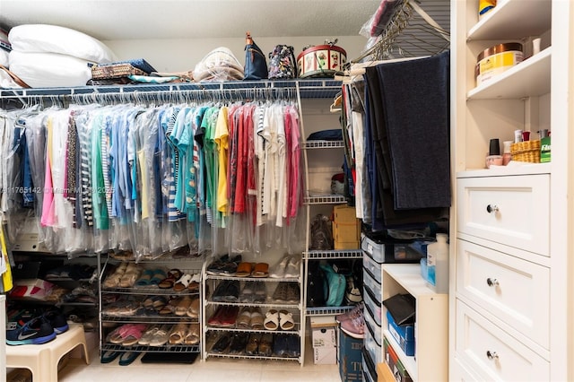 spacious closet featuring tile patterned flooring