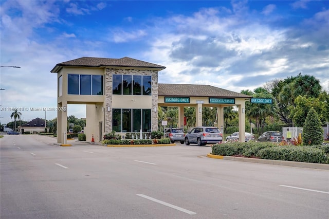 view of property with uncovered parking