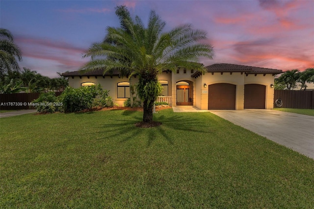 32006 SW 206th Ave, Homestead, FL 33030 - mediterranean / spanish home featuring concrete driveway, an attached garage, stucco siding, and a tiled roof