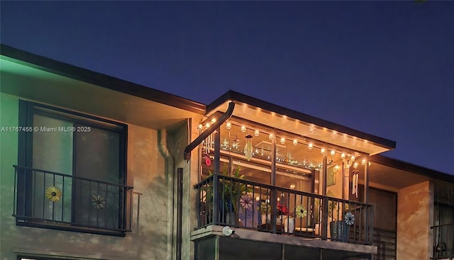 view of property exterior at night