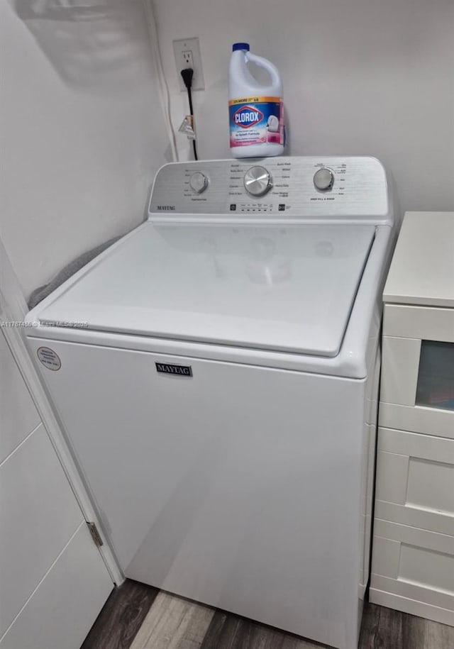washroom featuring laundry area, washer / clothes dryer, and dark wood-style flooring