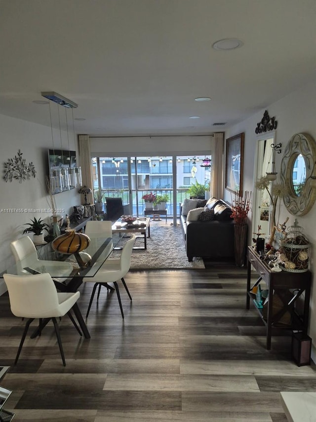 dining area with wood finished floors