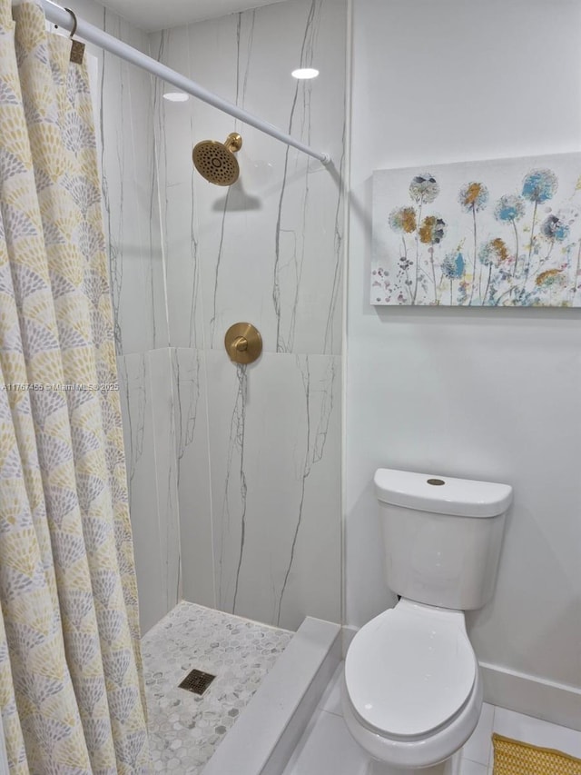 full bathroom featuring a marble finish shower and toilet
