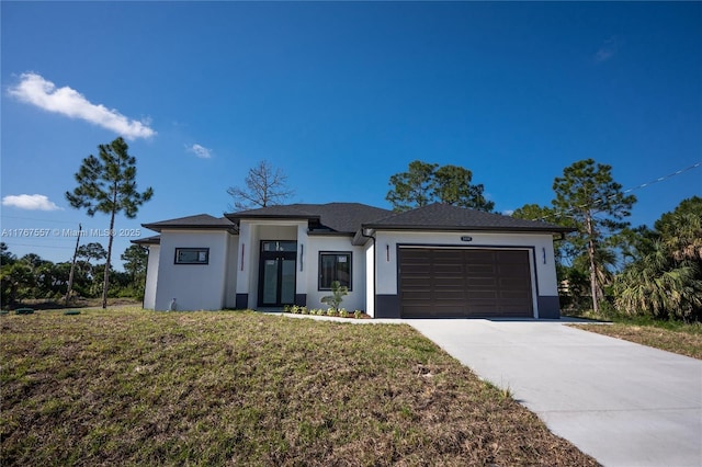 1254 S Ellipse St E, Lehigh Acres, FL 33974 - prairie-style home featuring concrete driveway, a garage, a front yard, and stucco siding