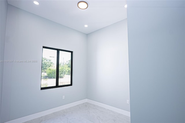 1254 S Ellipse St E, Lehigh Acres, FL 33974 - spare room with baseboards, recessed lighting, and marble finish floor