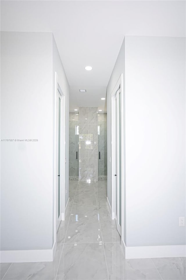 1254 S Ellipse St E, Lehigh Acres, FL 33974 - hallway featuring baseboards and marble finish floor