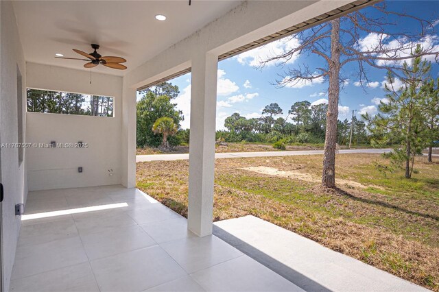 1254 S Ellipse St E, Lehigh Acres, FL 33974 - view of patio / terrace featuring ceiling fan