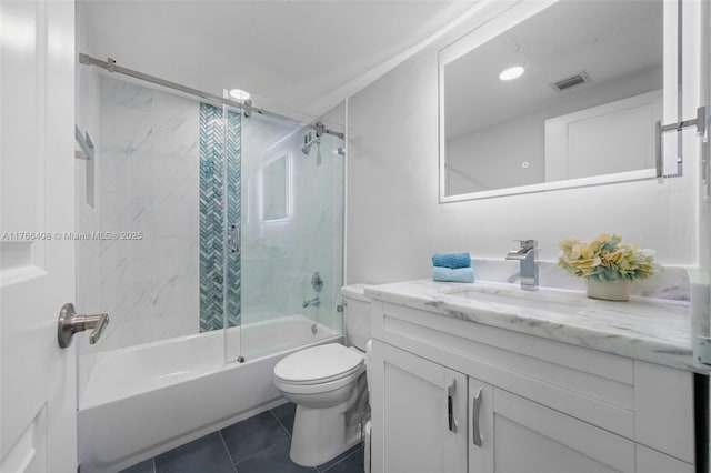 bathroom with tile patterned flooring, visible vents, bath / shower combo with glass door, toilet, and vanity