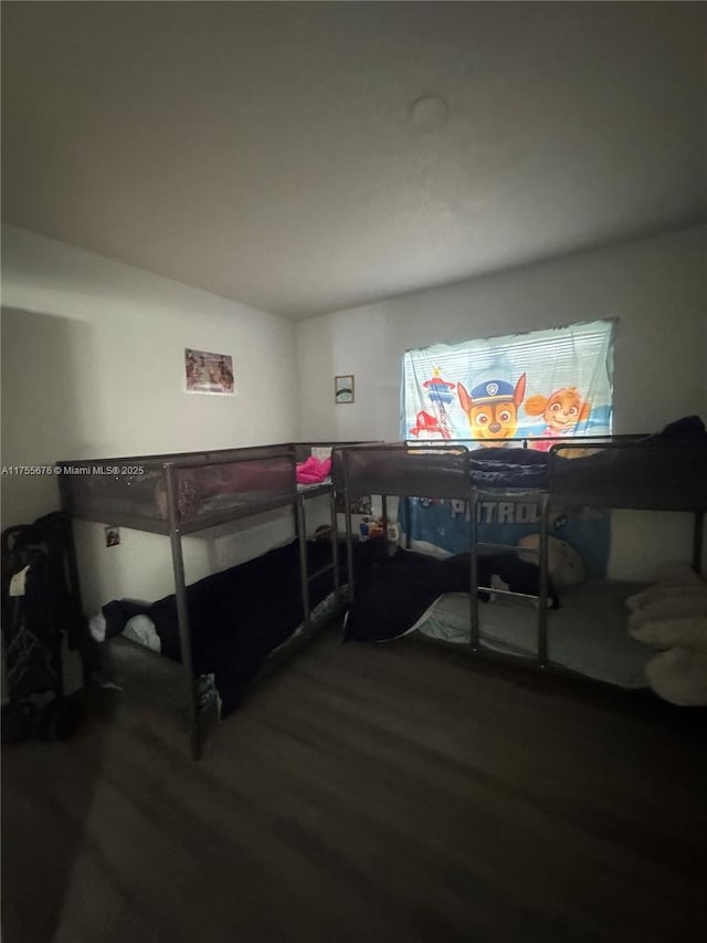 bedroom with wood finished floors