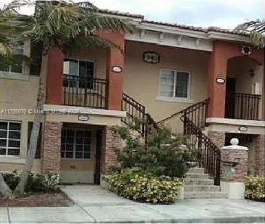 view of property featuring stairs