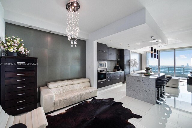 900 Biscayne Blvd Unit 4504, Miami, FL 33132 - living room featuring light tile patterned floors and a wall of windows