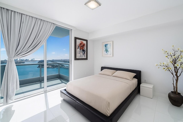 900 Biscayne Blvd Unit 4504, Miami, FL 33132 - bedroom featuring access to exterior, multiple windows, baseboards, floor to ceiling windows, and light tile patterned floors