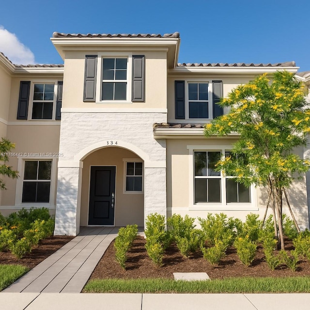 2737 SE 17th St, Homestead, FL 33035 - view of front facade featuring a tiled roof and stucco siding