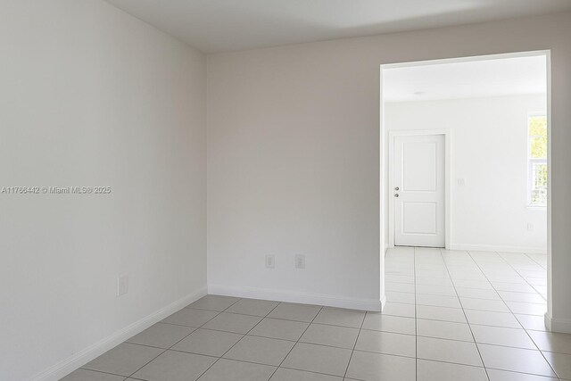 2737 SE 17th St, Homestead, FL 33035 - spare room featuring light tile patterned floors and baseboards