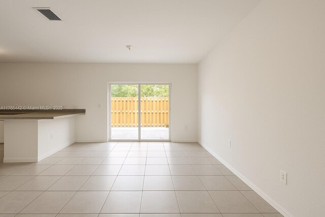 2737 SE 17th St, Homestead, FL 33035 - empty room featuring light tile patterned floors and baseboards