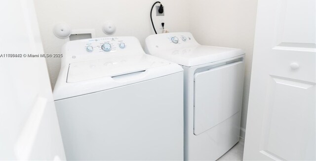 2737 SE 17th St, Homestead, FL 33035 - clothes washing area featuring washing machine and dryer